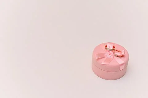 A gift box with two wedding rings. mock up Stock Photos