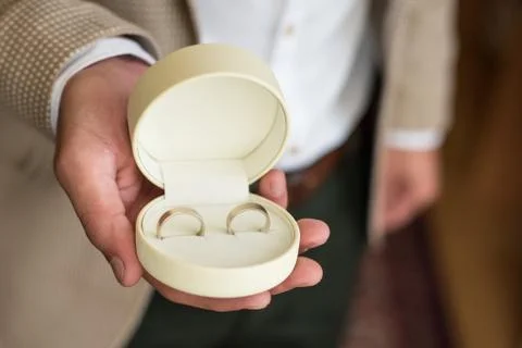 Gift box with wedding rings Stock Photos