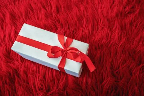 Gift box wrapped in diffrent color paper with ribbon bow Stock Photos