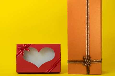 Gift box on yellow background Fotos Stock