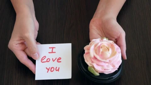Gift box of Zefir as pink rose and I love you card in hand, Gift box of Zef.. Stock Footage 295215434