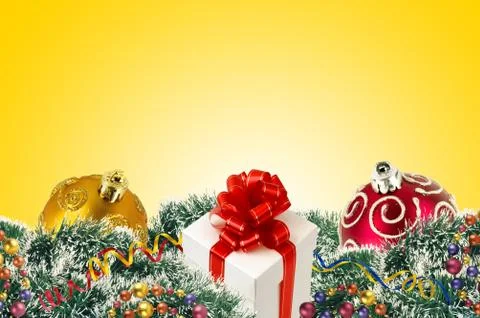 Gift boxes and christmas tree ornaments and christmas tree branches and chris Stock Photos