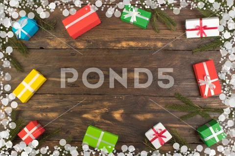 Gift boxes and colorful present for christmas on wood table. Top view with co Stock Photos