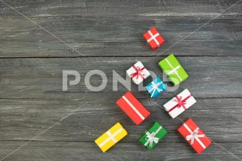 Gift boxes and colorful present for christmas on wood table. Top view with co Stock Photos