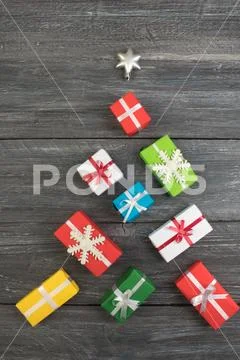 Gift boxes and colorful present for christmas on wood table. Top view with co Stock Photos