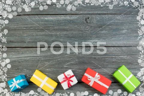 Gift boxes and colorful present for christmas on wood table. Top view with co Stock Photos