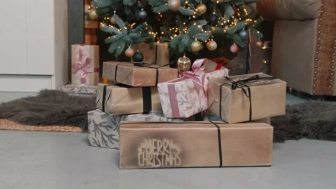 Gift boxes and decoration under the Christmas tree. Stock Footage 142954312