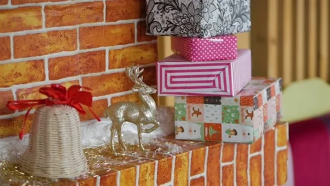 Gift boxes and New Year's decorations on the background of a brick wall Stock Footage 89671018