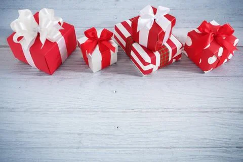 Gift boxes and present on wood table background Фото