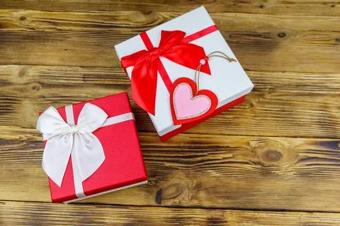 Gift boxes and red heart on a wooden background. Valentine's Day concept 写真素材