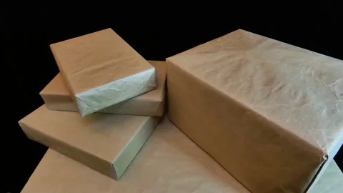 Gift boxes are packed with kraft paper Stock-Footage 141019837