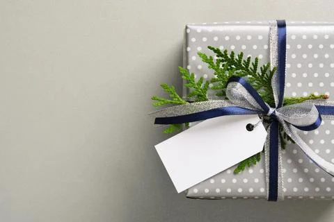 The gift boxes are wrapped in silver polka dot paper and decorated with dar.. Stock Photos