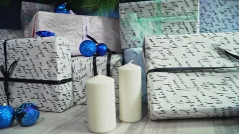 A gift boxes, balls and candles under Cristmas tree. Holiday anticipation Stock Footage 144272930