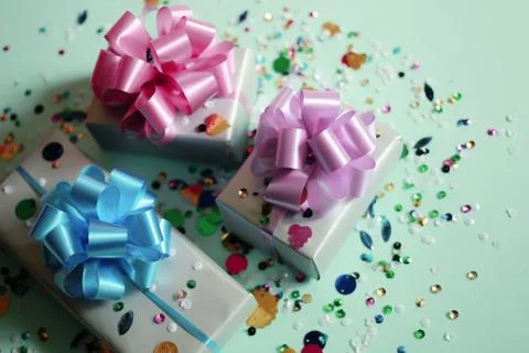 The gift boxes on a blue festive background with sparkles Stock Photos