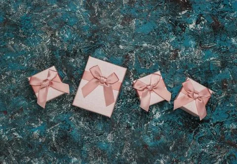 Gift boxes with bow on blue concrete background. Shopping in Paris, souvenirs 스톡 사진