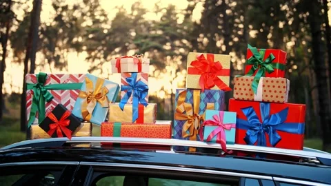 Gift boxes in car. delivery. donation, charity. many beautifully wrapped parcels 스톡 동영상 160917399