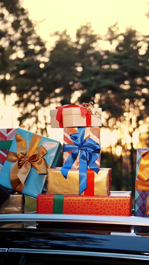 Gift boxes in car. delivery. donation, charity. many beautifully wrapped parcels 스톡 동영상 319017273