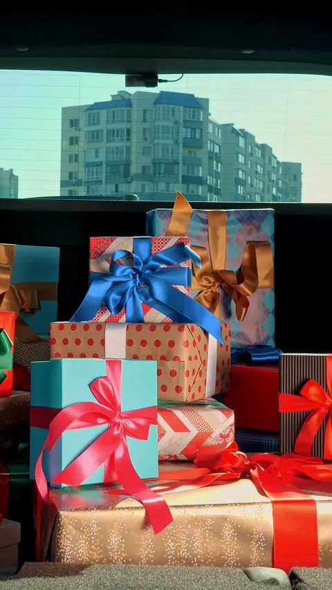 Gift boxes in the car. delivery service. many beautifully wrapped parcels, boxes Stock Footage 318807579