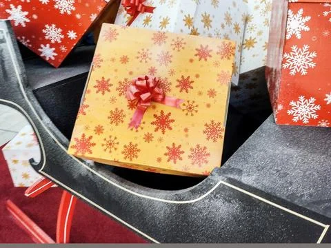 Gift boxes for Christmas in a sleigh Stock Photos