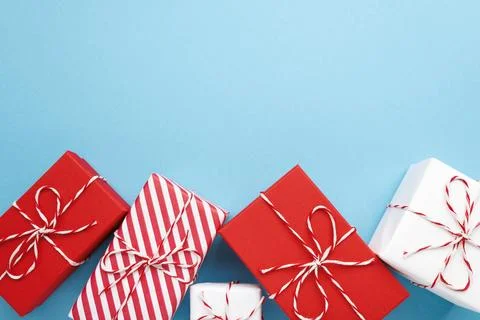 Gift boxes on color background, flat lay, space for text Stock-Fotos