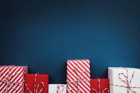 Gift boxes on color background, flat lay, space for text Stock Photos