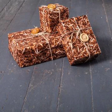 Gift boxes on dark wood background Stock Photos