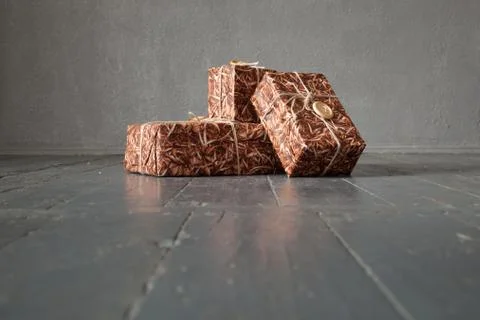 Gift boxes on dark wood background Stock Photos