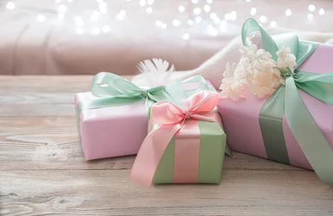 Gift boxes on a festive background. Side view, with space to copy. Stock Photos