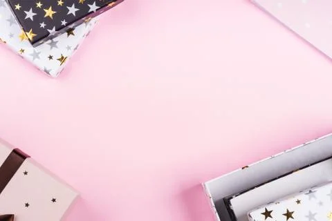 Gift boxes frame on pink. Festive concept flat lay Stock Photos