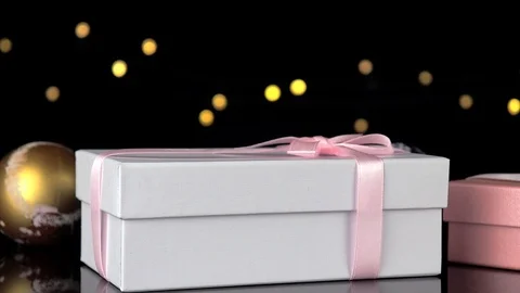 Gift boxes on a glossy table. Stock Footage 120914704
