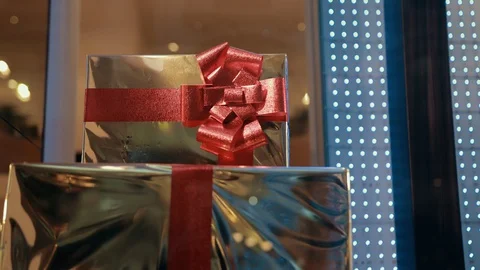Gift Boxes Of Gold Color With Red Ribbon Are Waiting For Owner, Packed Surprise Video stock 129892832