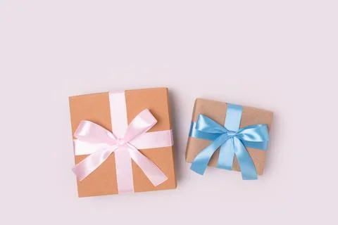 Gift boxes on a gray background. Present tied with ribbon. Stock Photos