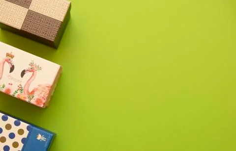 Gift boxes on a green background, place for an inscription for free Stock Photos