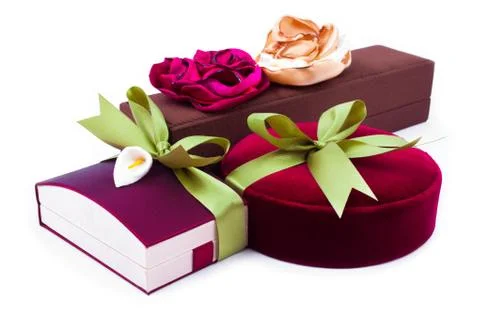 Gift boxes with a green bow on white background Stock Photos