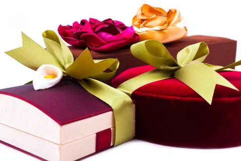 Gift boxes with a green bow on white background Stock Photos