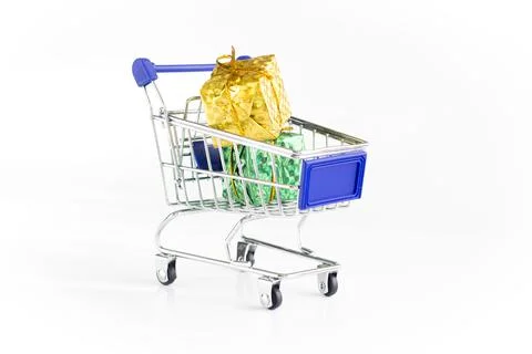 Gift boxes inside the toy shopping trolley. Stock photo. Stock Photos