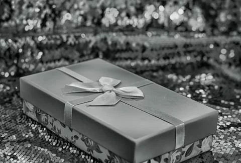 Gift boxes lie on a red shiny fabric. Package of gifts for Christmas.bokeh, s Stock Photos