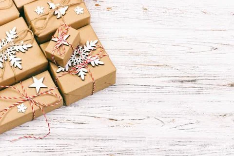 Gift boxes on light wooden background with copy space top view. Toned Stock Photos