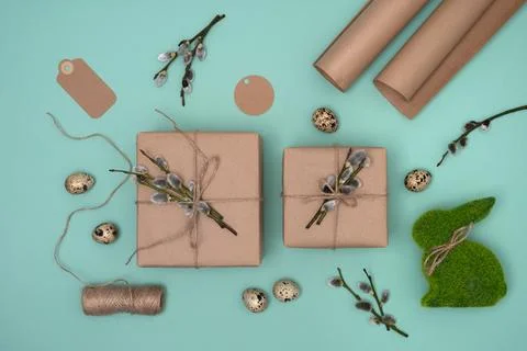 Gift boxes made of craft paper with willow twigs, craft paper, quail eggs Stock Photos