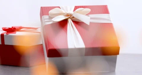 Gift Boxes With Magic Bokeh On Foreground- 4K Stock Footage 103487677
