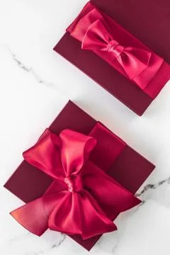 Gift boxes on marble background, holiday flatlay Stock Photos