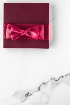 Gift boxes on marble background, holiday flatlay Stock Photos