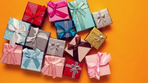 Gift boxes moving on yellow background.Holiday and celebrating concept. Stock Footage 142158896