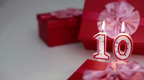 Gift boxes with number candles (10)  Stock Footage 8621201