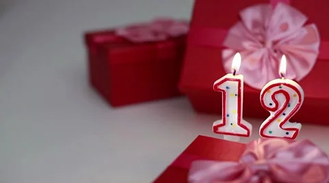 Gift boxes with number candles (12)  Stock Footage 8621701