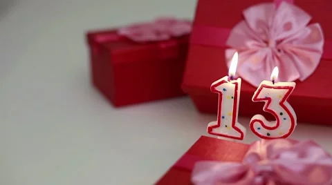 Gift boxes with number candles (13)  Stock Footage 8621680