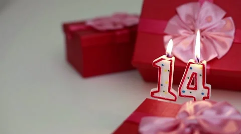 Gift boxes with number candles (14)  Stock Footage 8621691