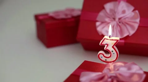 Gift boxes with number candles (3)  Stock Footage 8632699