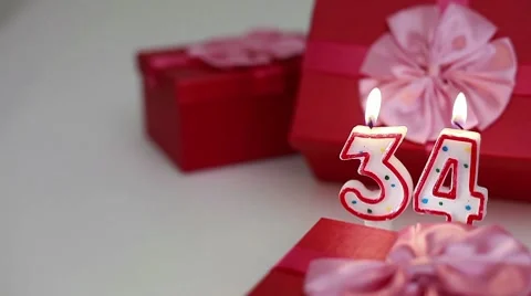 Gift boxes with number candles (34)  Stock Footage 8631177