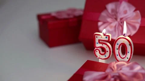 Gift boxes with number candles (50)  Stock Footage 8631370